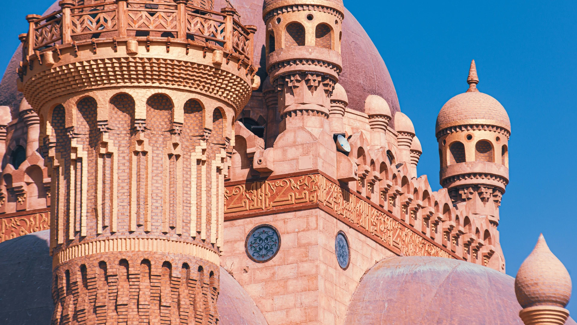 El Alamein, Egypt - Intricate architecture of the sahaba mosque in sharm el sheikh under a clear blue sky.