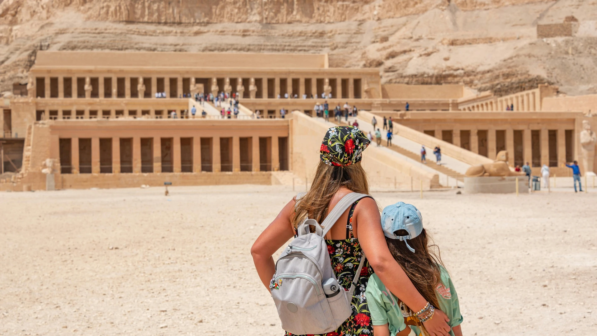 El Alamein, Egypt - Woman and child explore the historic temple of hatshepsut in egypt.