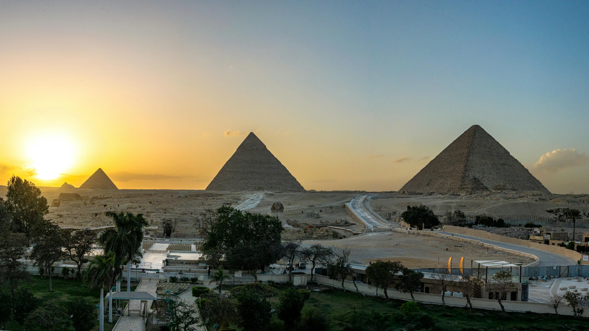 Giza, Egypt - Breathtaking view of the pyramids of giza at sunset, capturing ancient history and stunning landscape.