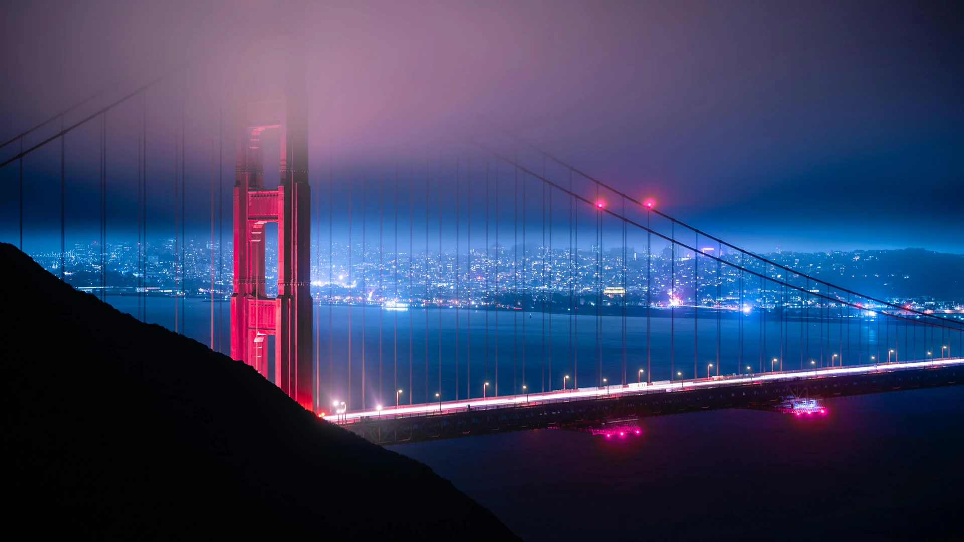 Makadi Bay, Egypt - Moody night view of the fog-covered golden gate bridge in san francisco.