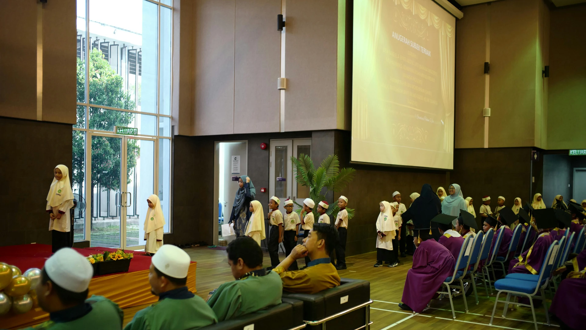 Marsa Alam, Egypt - Young students in traditional attire at a school graduation ceremony in shah alam, malaysia.