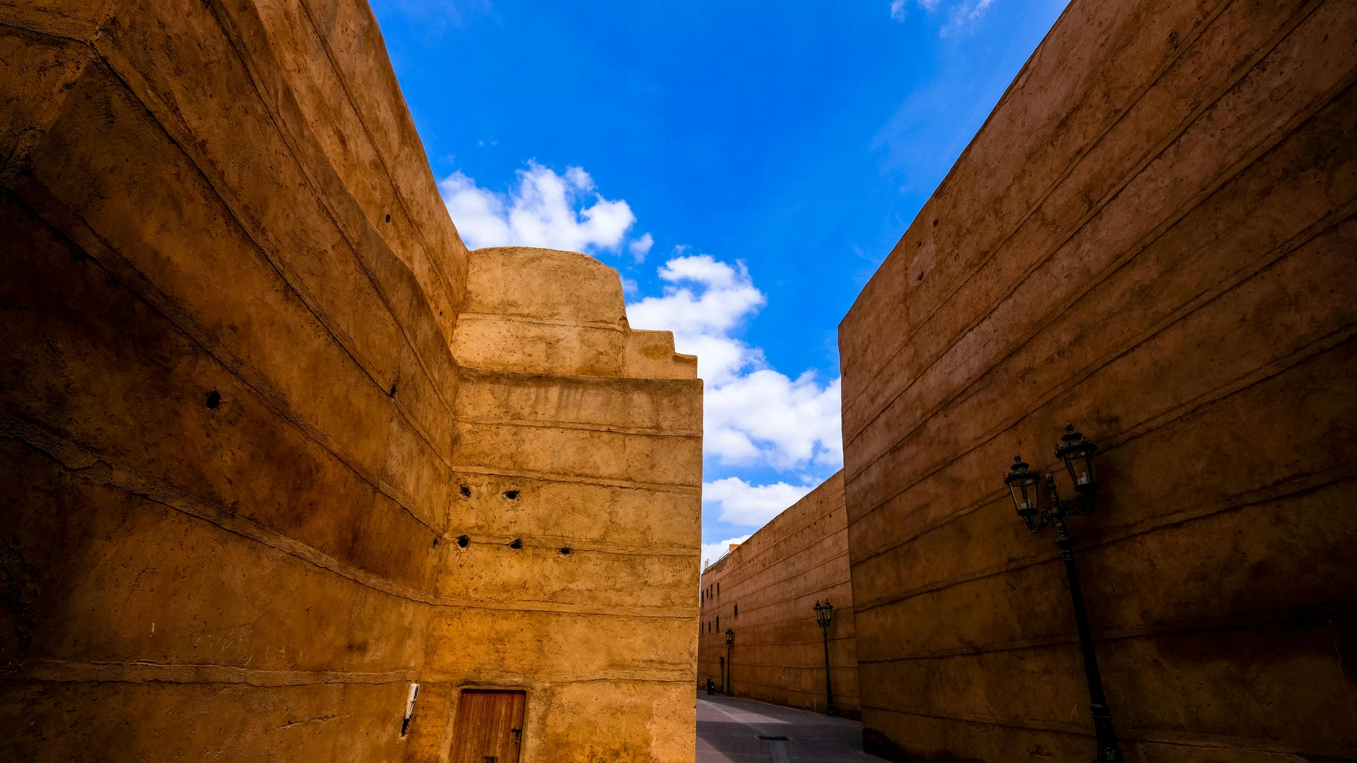 Sahl Hasheesh, Egypt - Discover the historic architecture of marrakech with high walls under a vibrant blue sky.