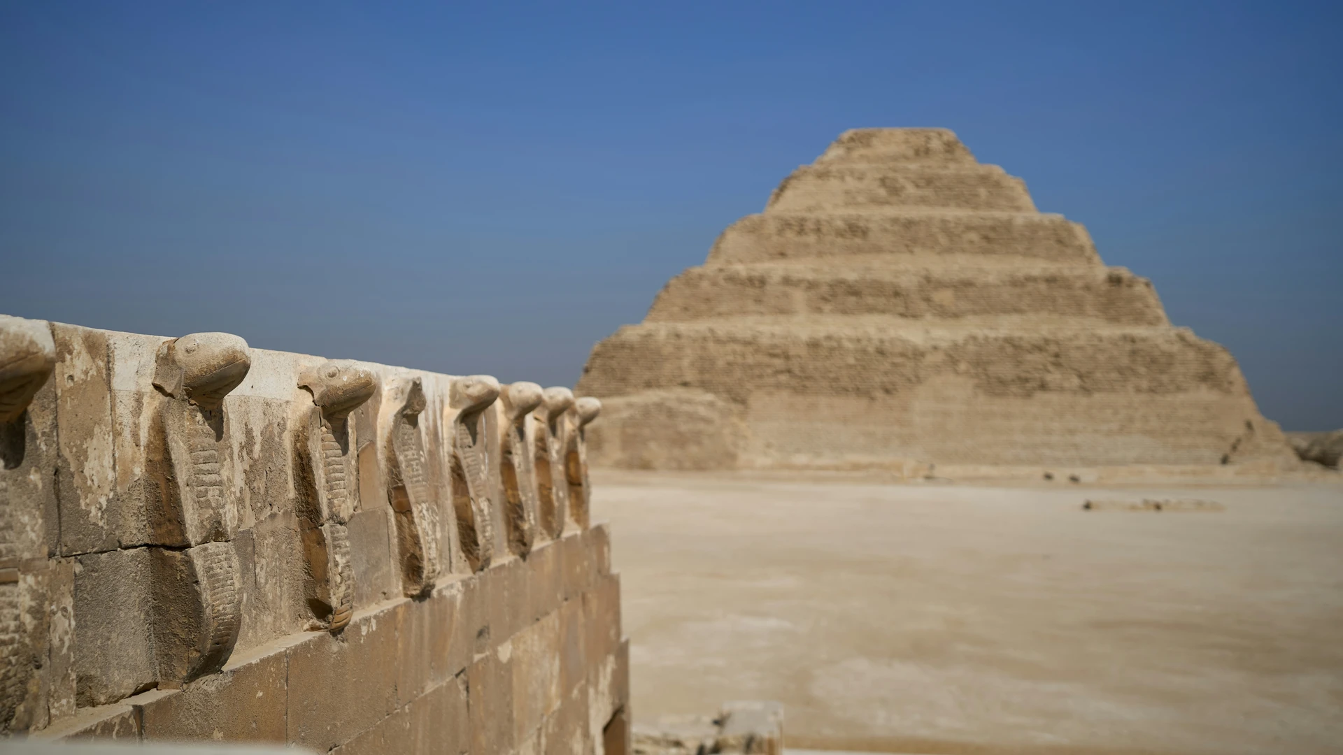 Ain Sokhna, Egypt - Stone wall with a pyramid in the background