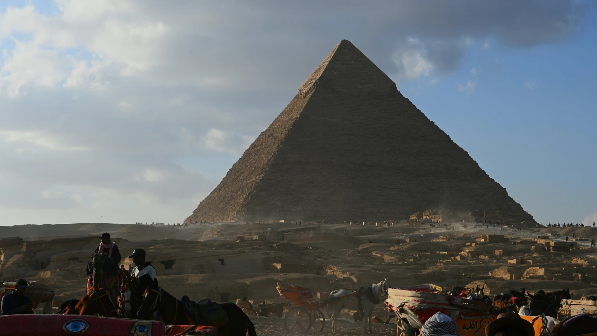 Ain Sokhna, Egypt - Great pyramid of giza with people and horses.