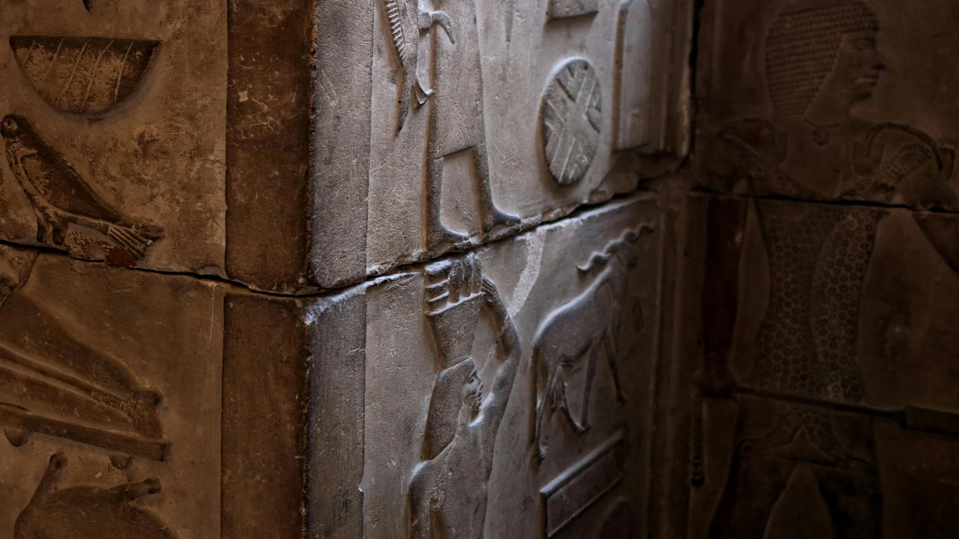 Aswan, Egypt - Close-up of detailed ancient egyptian stone carvings in a cairo museum showcasing cultural art and architecture.