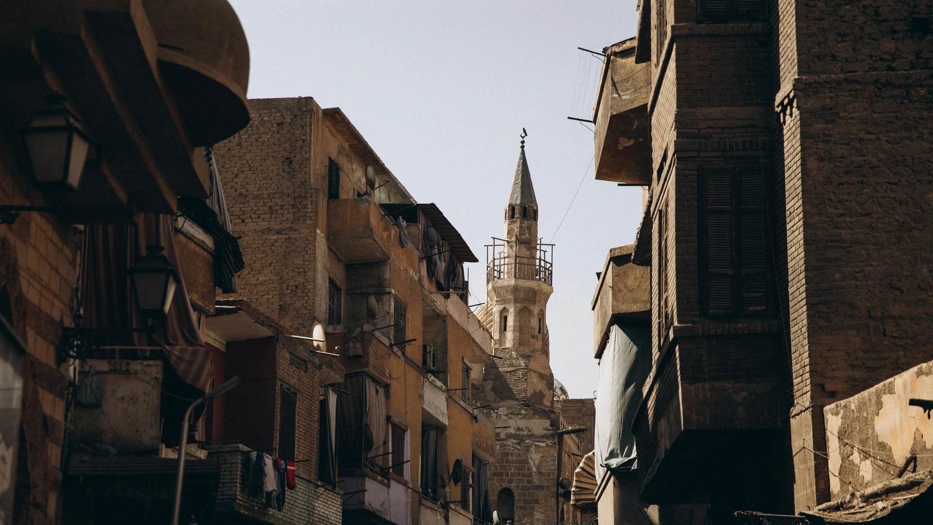 Cairo, Egypt - Narrow street in cairo featuring historic islamic architecture and urban life.