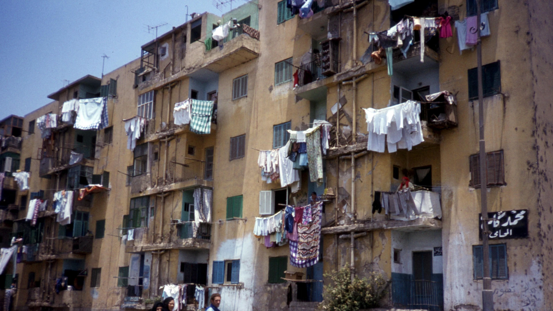 Cairo, Egypt - Urban scene with pedestrians and apartment buildings in cairo, egypt.