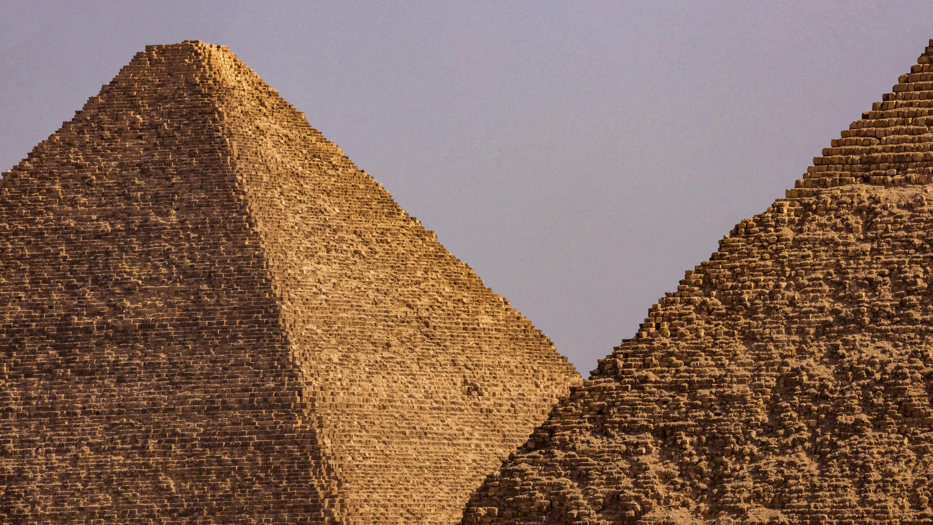 Dahab, Egypt - Close-up view of two iconic egyptian pyramids under a clear blue sky.