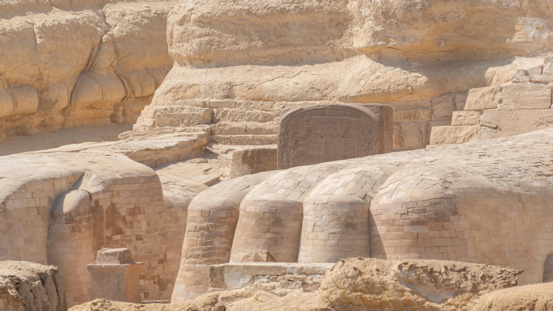 Giza, Egypt - Close-up of the ancient sphinx and surrounding stone structures in giza captured in detail.
