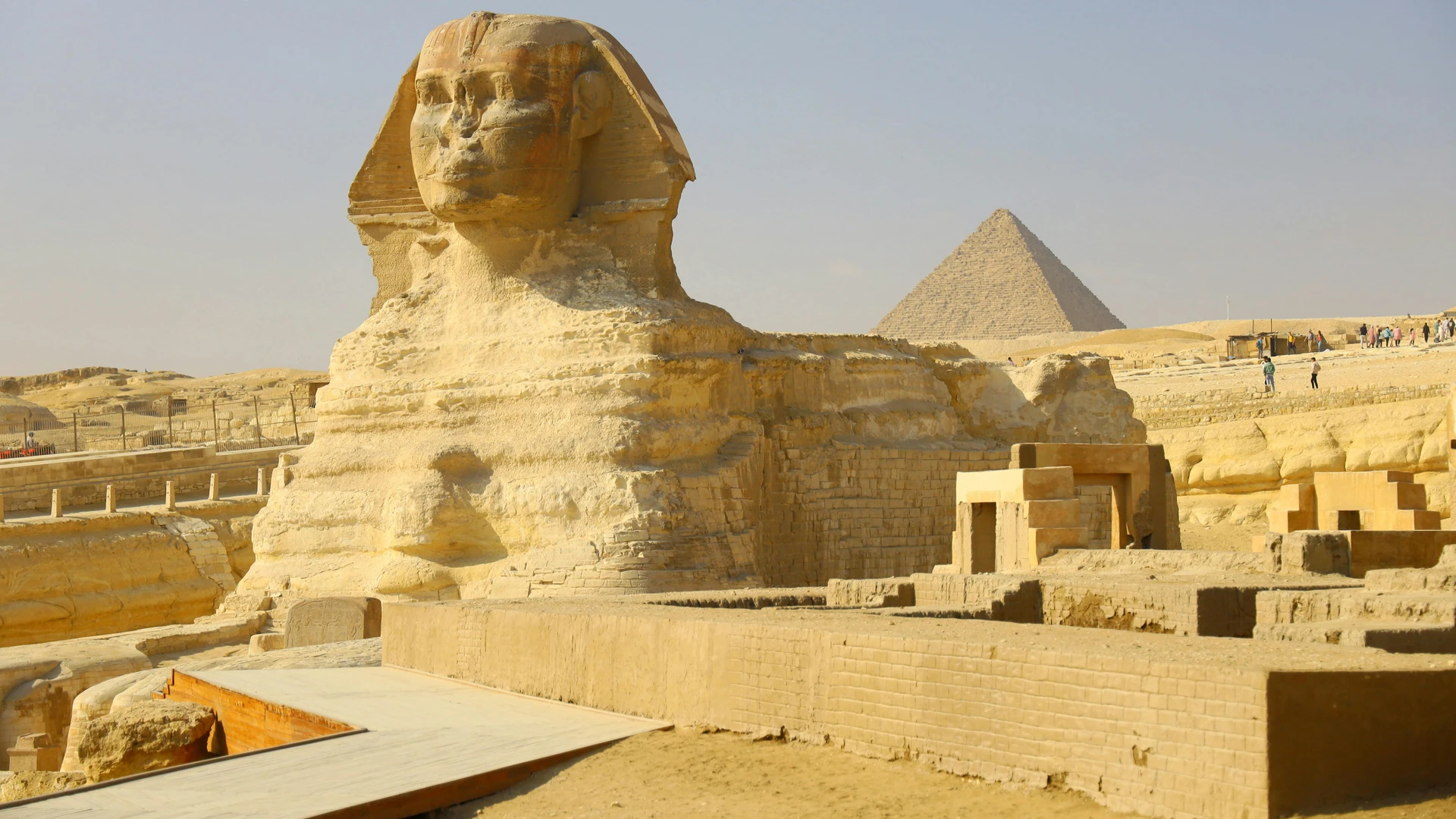 Giza, Egypt - Iconic great sphinx and pyramid of giza captured on a sunny day.