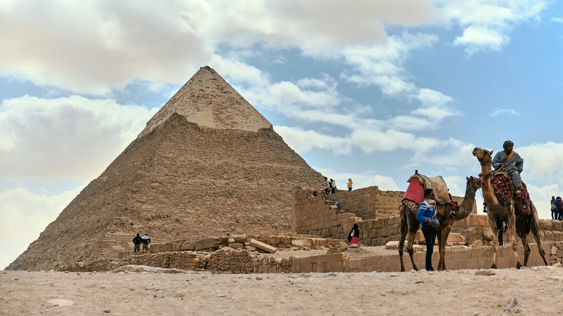 Safaga, Egypt - Two camel st anding near pyramid