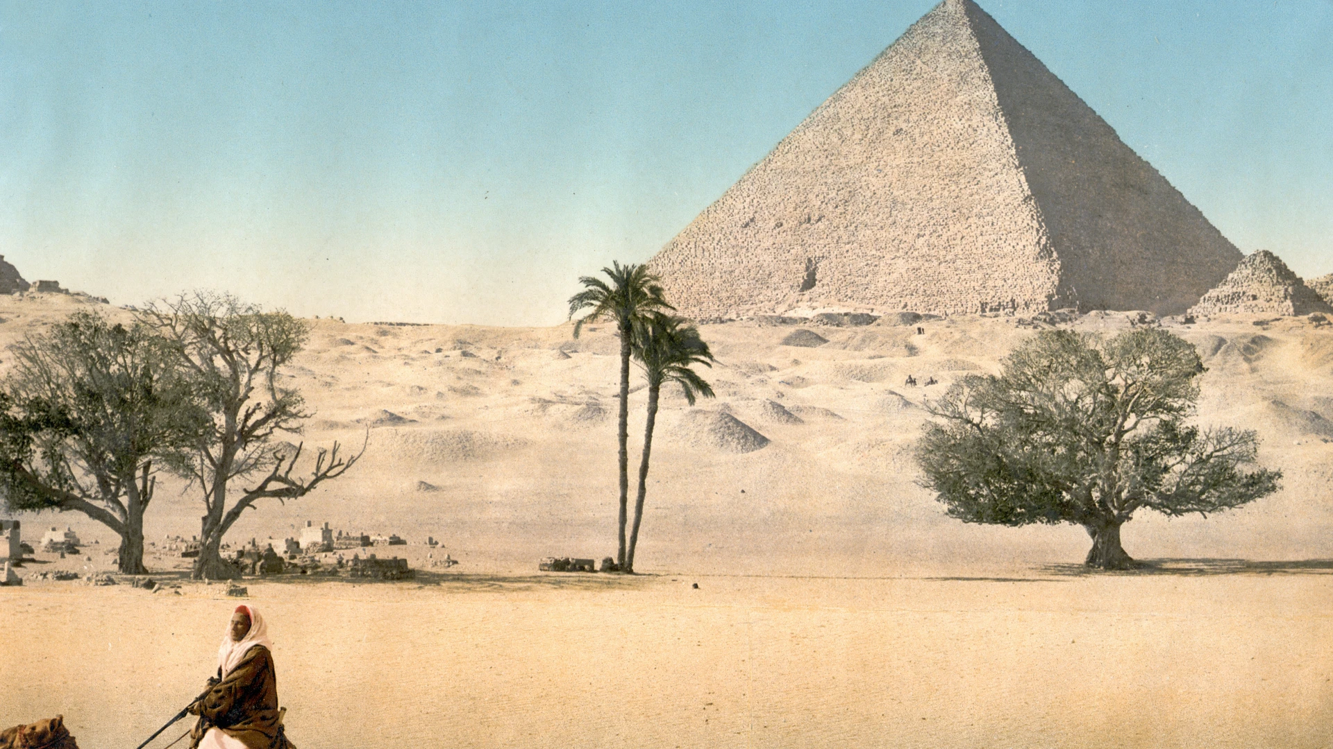 Safaga, Egypt - Resting bedouins and the grand pyramid, cairo, egypt